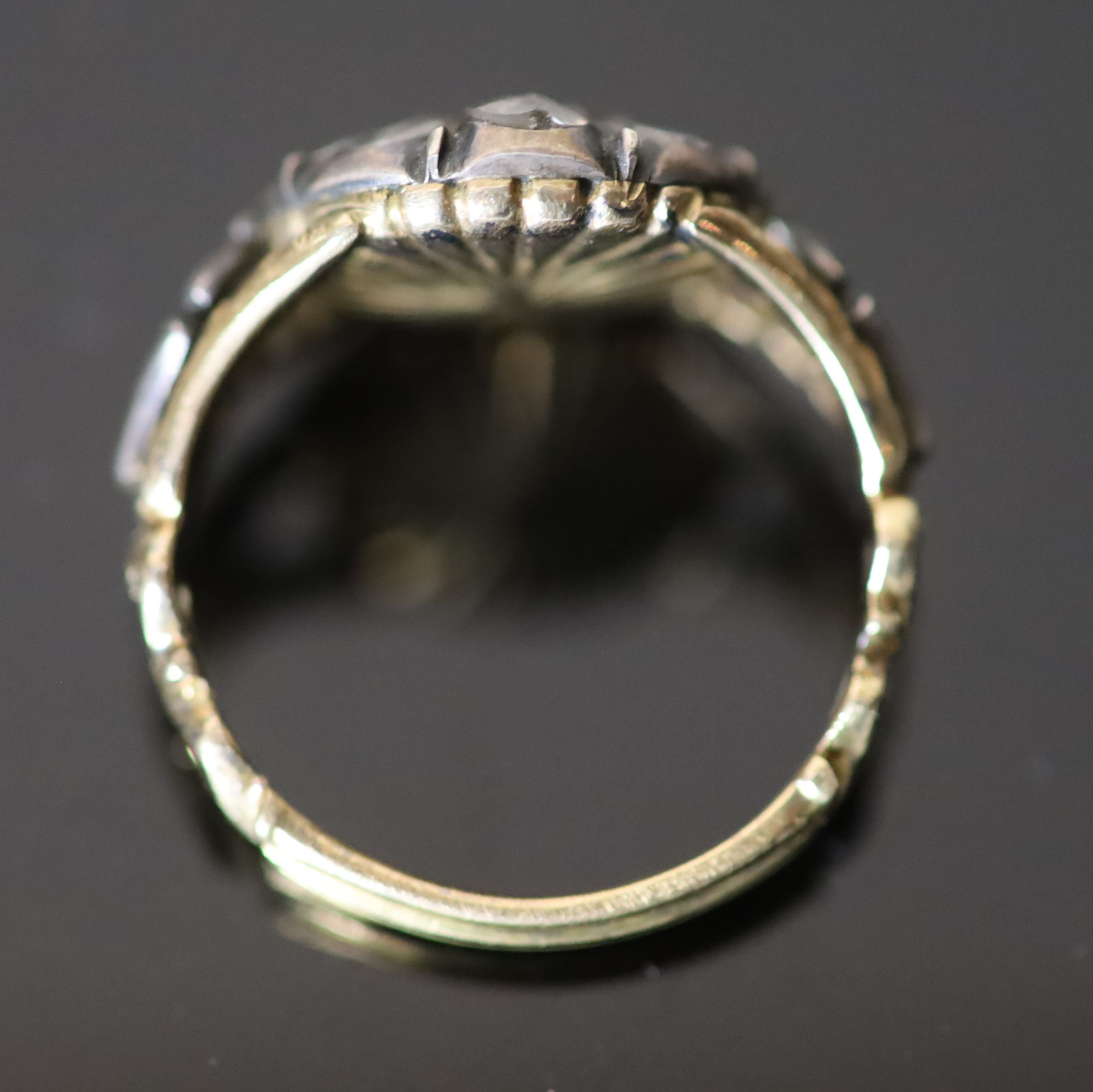 A George III gold and silver, single stone citrine and eight rose cut diamond cluster set dress ring,